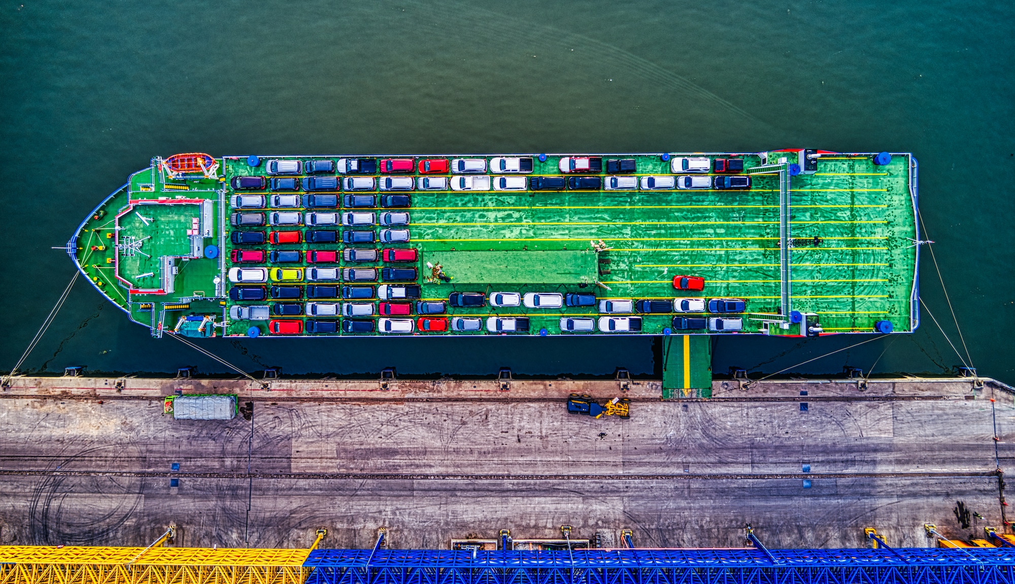 green cargo boat beside dock 2217513